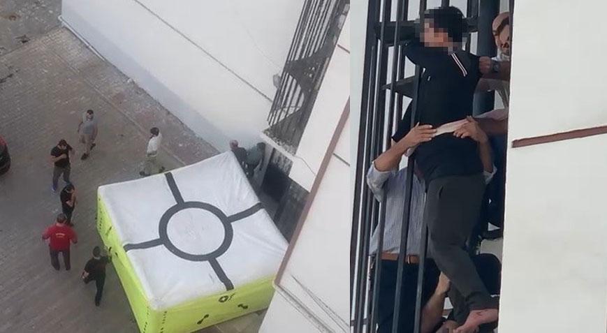 Yangın merdivenine sıkıştı! Düşmemesi için çarşafla bağlandı