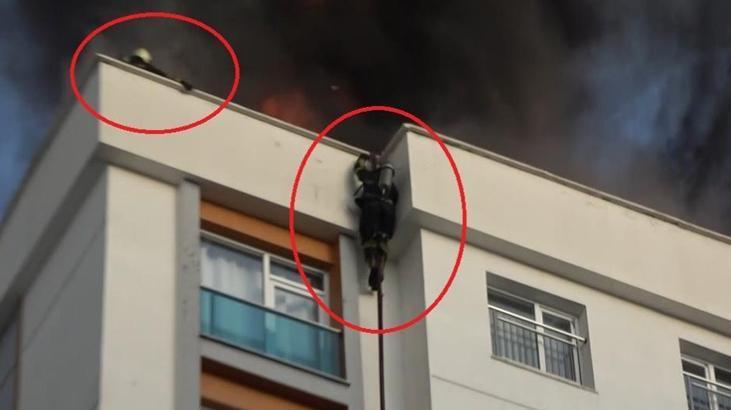 Korku dolu anlar! İtfaiye eri alevlerin arasında kaldı kendini aşağıya bıraktı